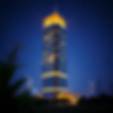 The Reflection Tower illuminated at night highlighting its striking silhouette against the skyline